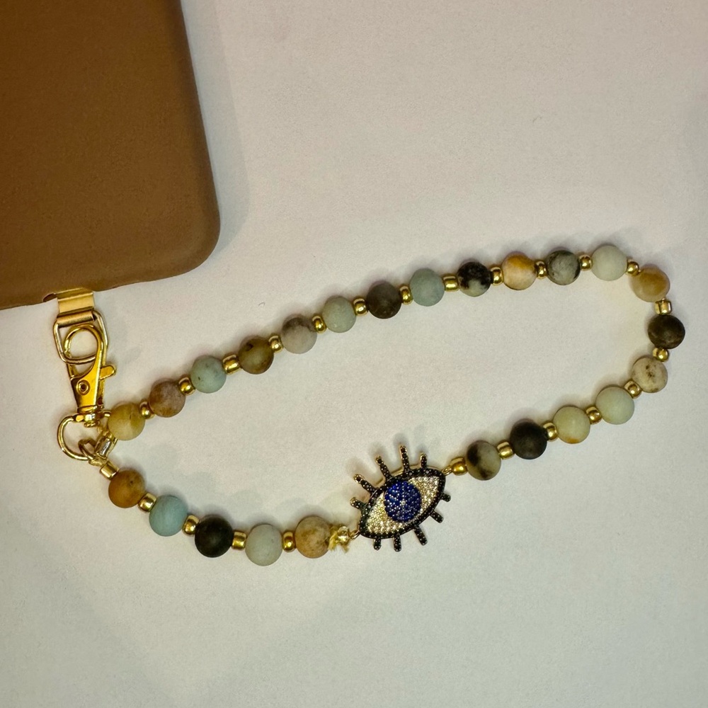 Cell phone wristlet from The Charm Hut works on any phone case